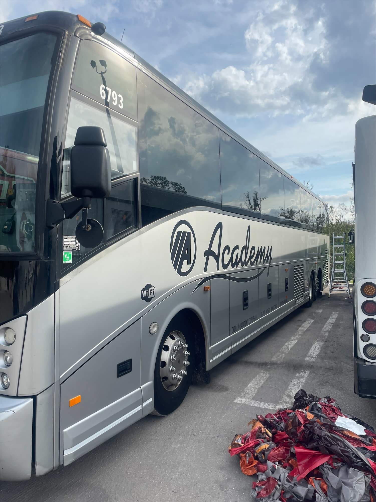 Bus wrap project that necessitated vinyl graphic removal first by Turbo Images